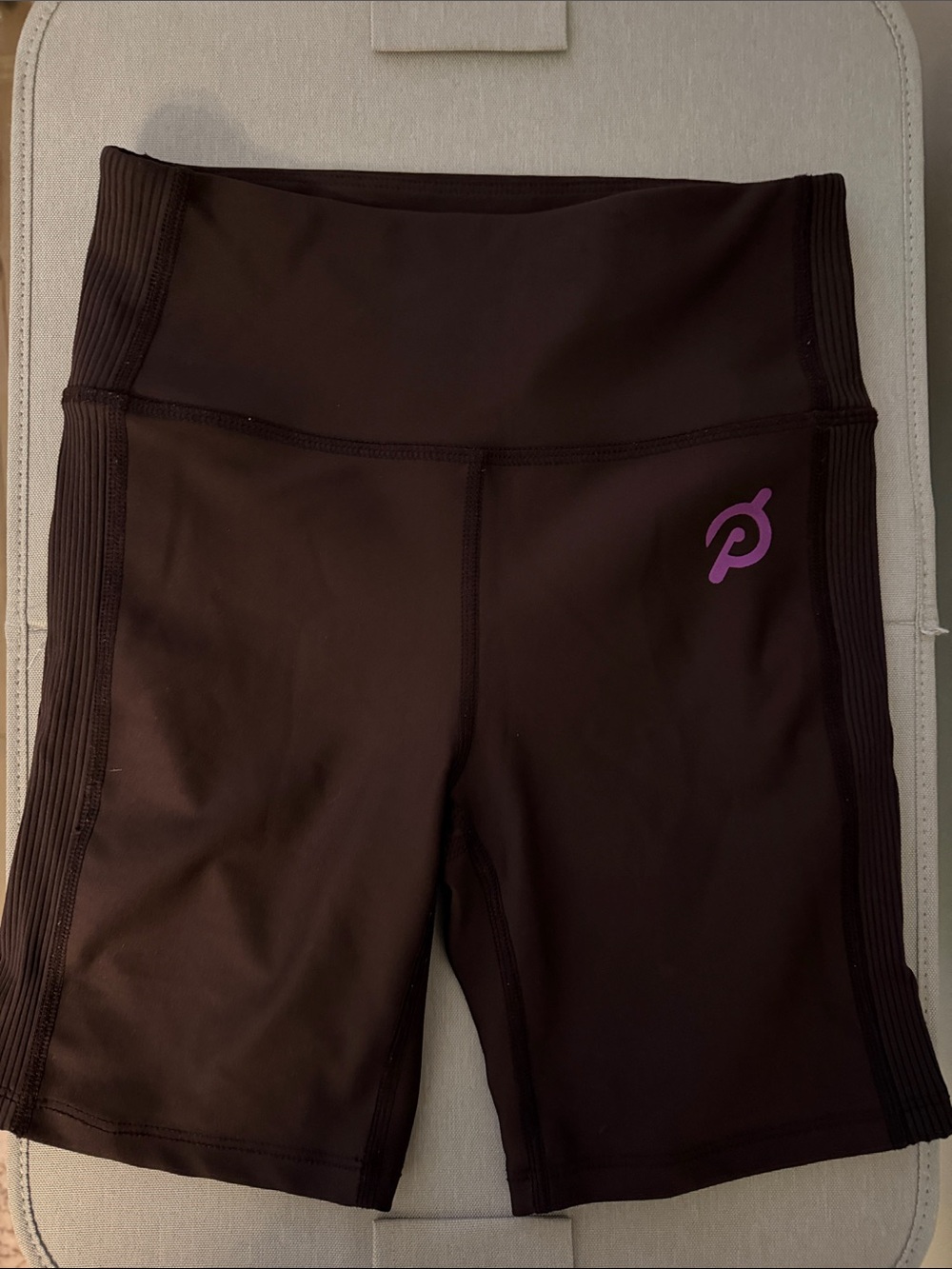 Peloton High-Rise Bike Shorts in Brown with Purple Logo